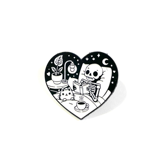 Skeleton Reading Heart pin (black background)